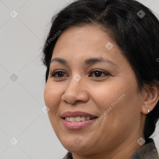 Joyful white adult female with medium  brown hair and brown eyes