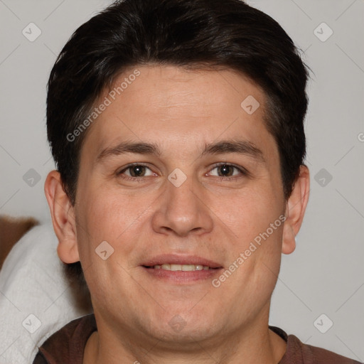 Joyful white adult male with short  brown hair and brown eyes