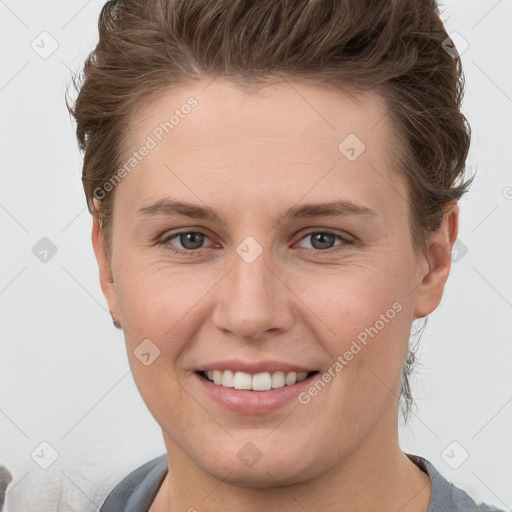 Joyful white young-adult female with short  brown hair and grey eyes