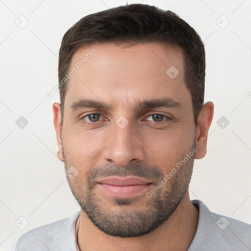 Joyful white young-adult male with short  brown hair and brown eyes