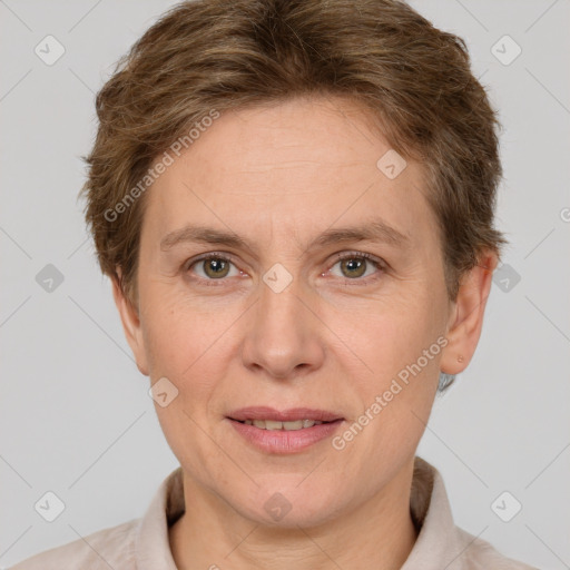 Joyful white adult female with short  brown hair and grey eyes