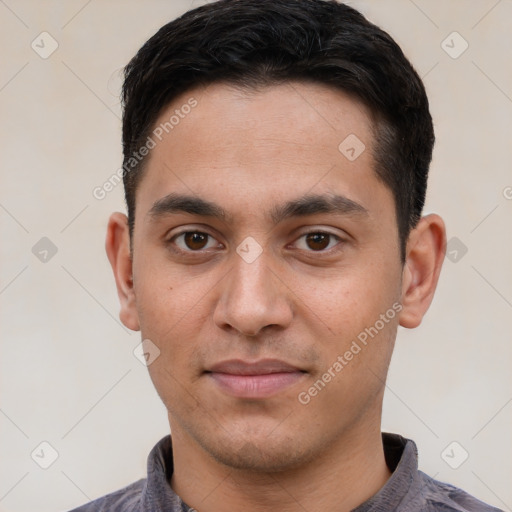 Joyful white young-adult male with short  black hair and brown eyes