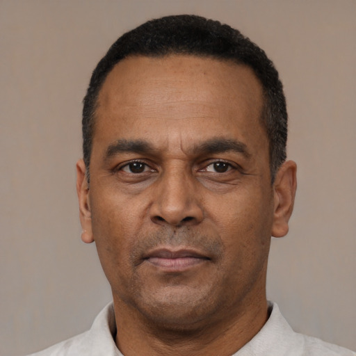 Neutral latino adult male with short  black hair and brown eyes