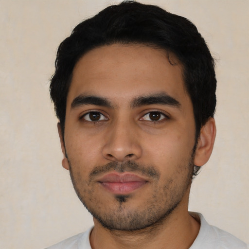 Neutral latino young-adult male with short  black hair and brown eyes