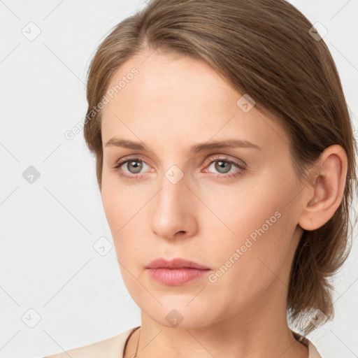 Neutral white young-adult female with medium  brown hair and grey eyes