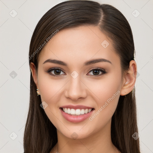 Joyful white young-adult female with long  brown hair and brown eyes