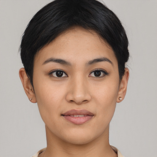 Joyful asian young-adult female with short  black hair and brown eyes
