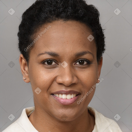 Joyful black young-adult female with short  brown hair and brown eyes