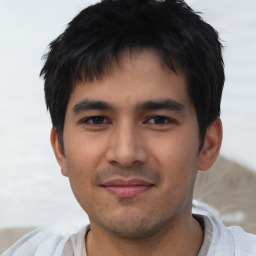 Joyful asian young-adult male with short  black hair and brown eyes