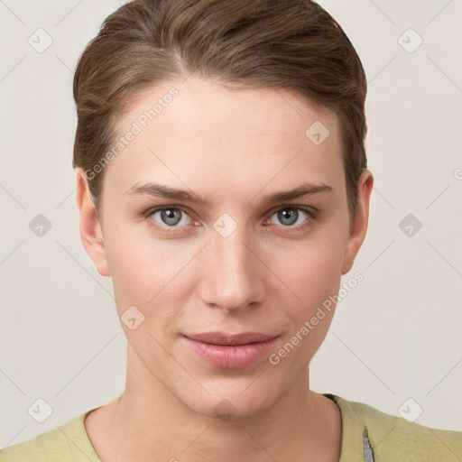 Joyful white young-adult female with short  brown hair and grey eyes