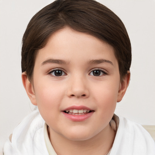 Joyful white child female with short  brown hair and brown eyes