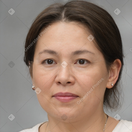 Joyful white adult female with medium  brown hair and brown eyes