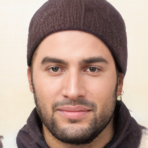 Joyful white young-adult male with short  black hair and brown eyes