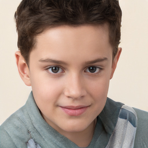 Joyful white child male with short  brown hair and brown eyes