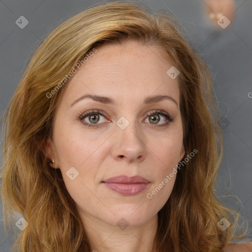 Joyful white adult female with long  brown hair and brown eyes