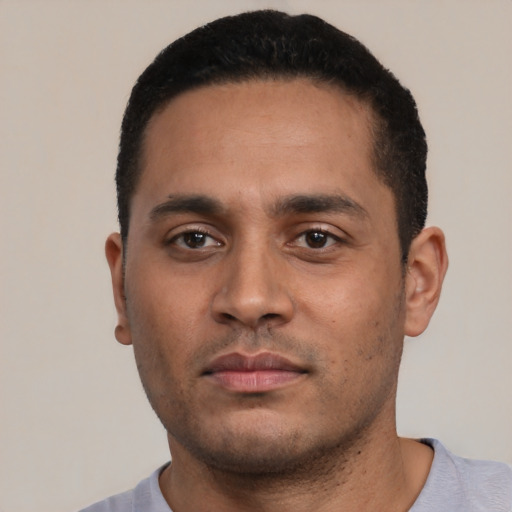 Neutral latino young-adult male with short  black hair and brown eyes
