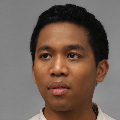 Neutral black young-adult male with short  black hair and brown eyes