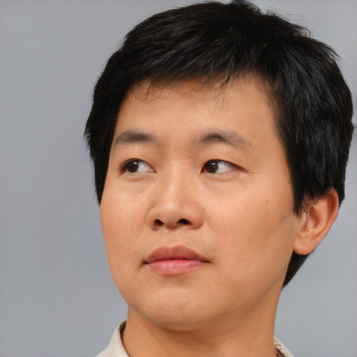 Neutral asian young-adult male with short  black hair and brown eyes