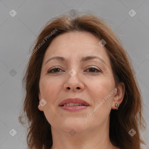 Joyful white adult female with medium  brown hair and brown eyes