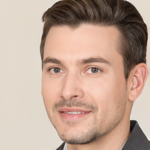 Joyful white adult male with short  brown hair and brown eyes