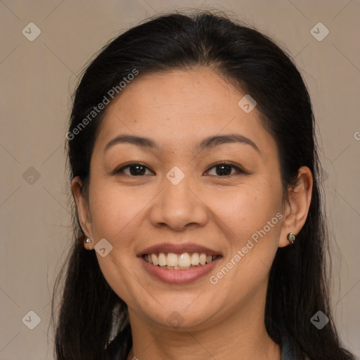 Joyful latino young-adult female with long  brown hair and brown eyes