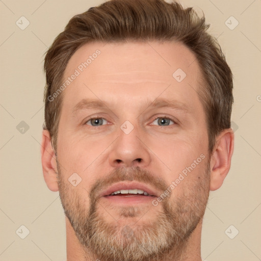 Joyful white adult male with short  brown hair and brown eyes