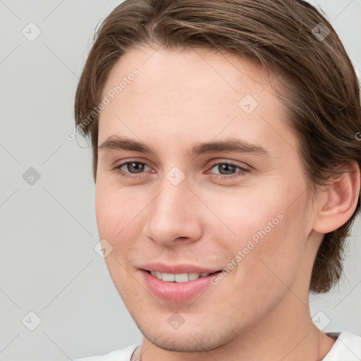 Joyful white young-adult female with short  brown hair and grey eyes