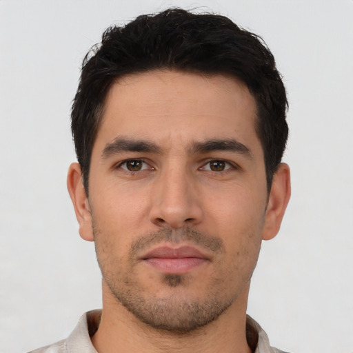 Neutral white young-adult male with short  black hair and brown eyes
