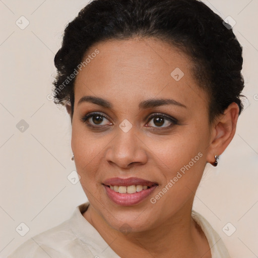 Joyful latino young-adult female with short  brown hair and brown eyes