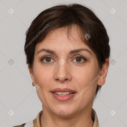 Joyful white adult female with short  brown hair and brown eyes