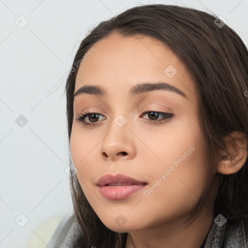 Joyful latino young-adult female with long  black hair and brown eyes