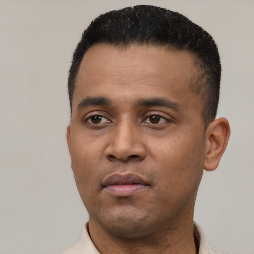 Neutral latino young-adult male with short  black hair and brown eyes