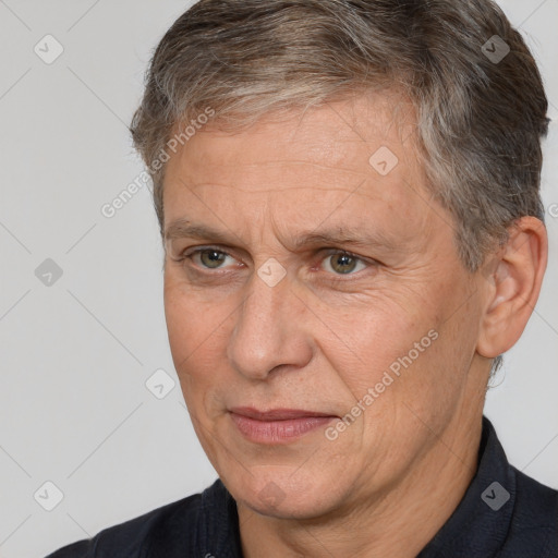 Joyful white middle-aged male with short  brown hair and brown eyes