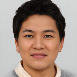 Joyful asian young-adult male with short  black hair and brown eyes