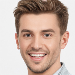 Joyful white young-adult male with short  brown hair and brown eyes