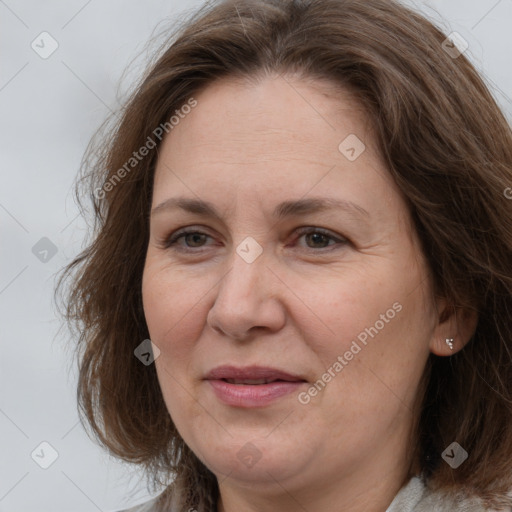 Joyful white adult female with medium  brown hair and brown eyes