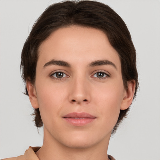 Neutral white young-adult female with medium  brown hair and brown eyes