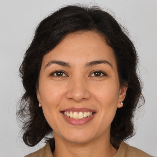 Joyful asian young-adult female with medium  brown hair and brown eyes