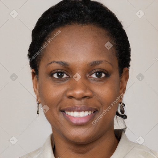 Joyful black young-adult female with short  brown hair and brown eyes