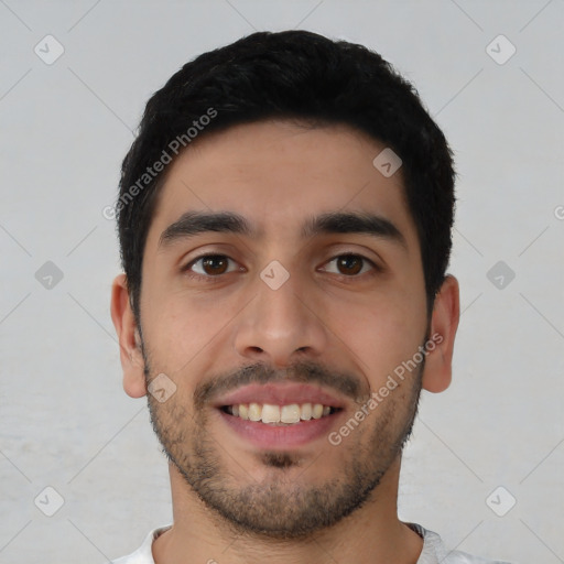 Joyful latino young-adult male with short  black hair and brown eyes