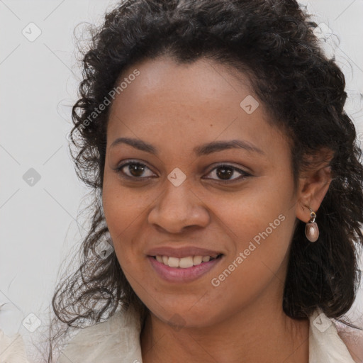 Joyful black young-adult female with long  brown hair and brown eyes