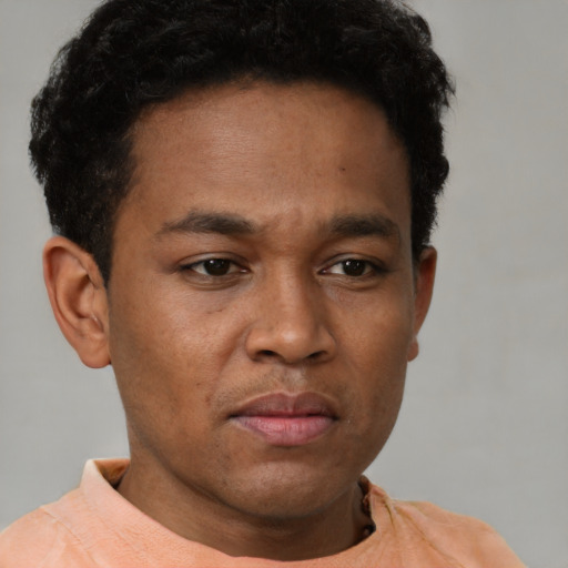 Neutral latino young-adult male with short  brown hair and brown eyes