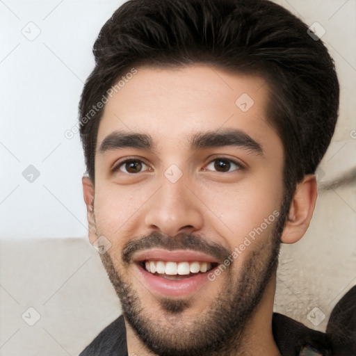 Joyful white young-adult male with short  black hair and brown eyes