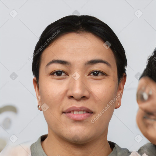 Joyful asian young-adult female with short  black hair and brown eyes