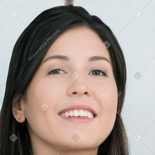 Joyful white young-adult female with long  black hair and brown eyes