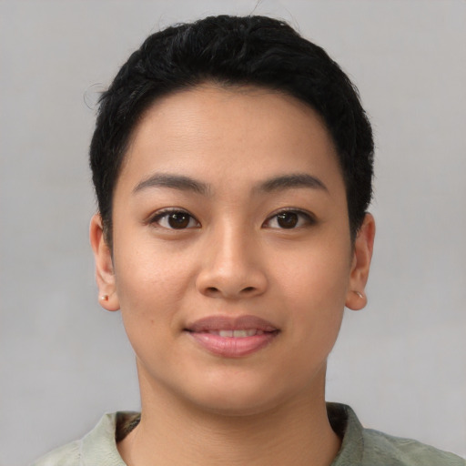 Joyful asian young-adult female with short  black hair and brown eyes