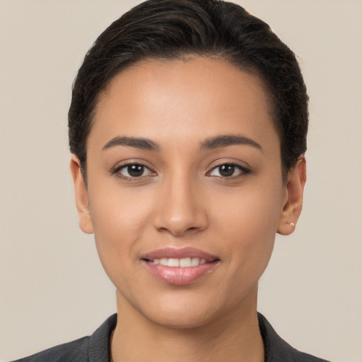 Joyful white young-adult female with short  brown hair and brown eyes