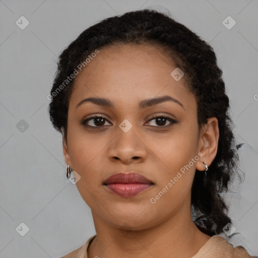 Joyful black young-adult female with long  brown hair and brown eyes