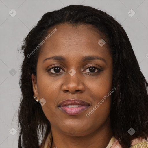 Joyful black young-adult female with long  black hair and brown eyes