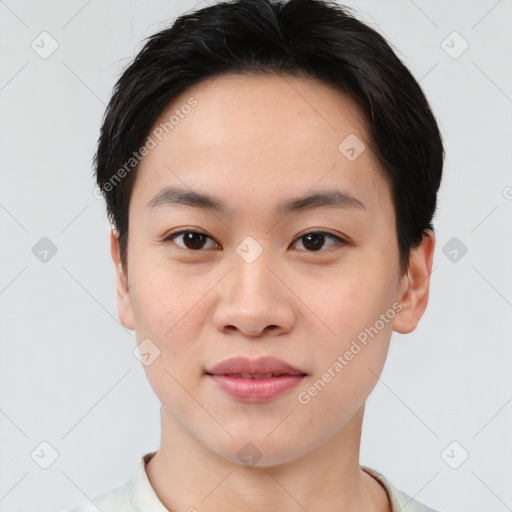 Joyful asian young-adult female with short  brown hair and brown eyes